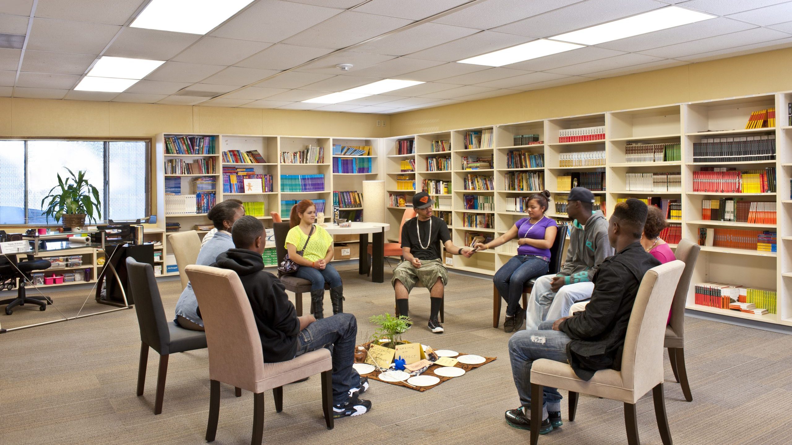 Youth sitting in chairs in a circle