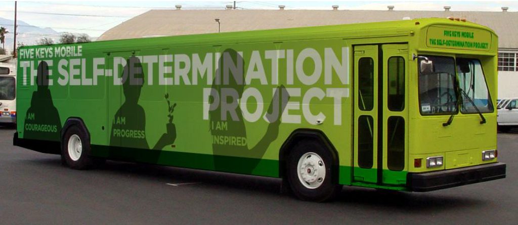 Front of green mobile classroom bus