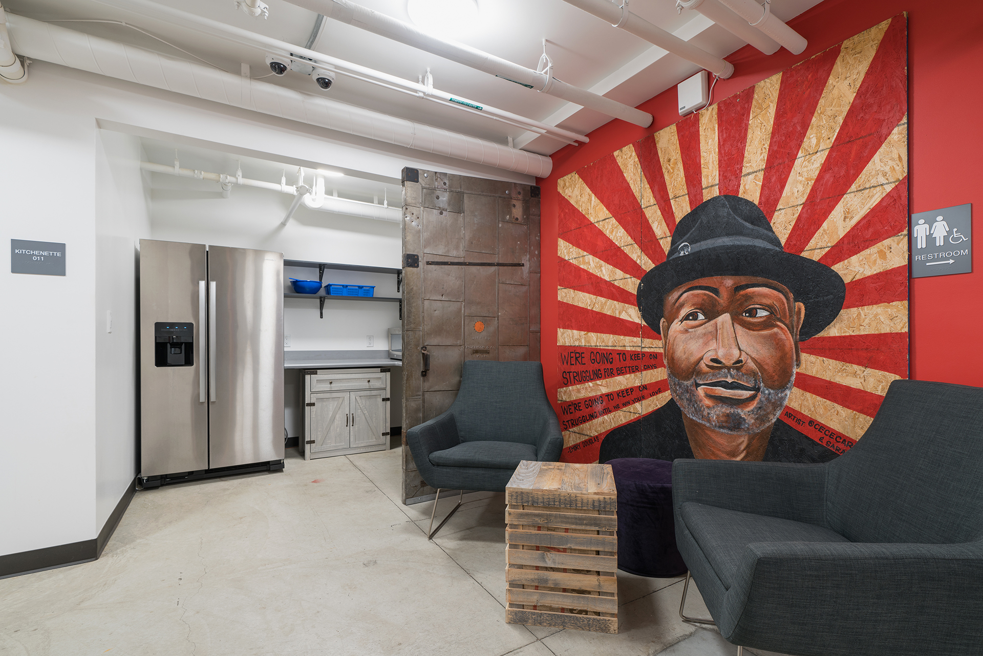 Mural of Emory Douglas at Restore Oakland (Artists: Cece Carpio, Sarai Reminisce | Photo: Ellyce Morgan)