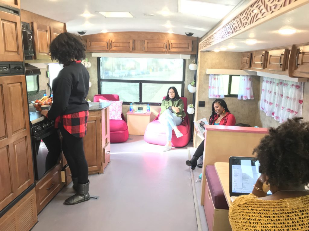 Women sitting and reading in trailer